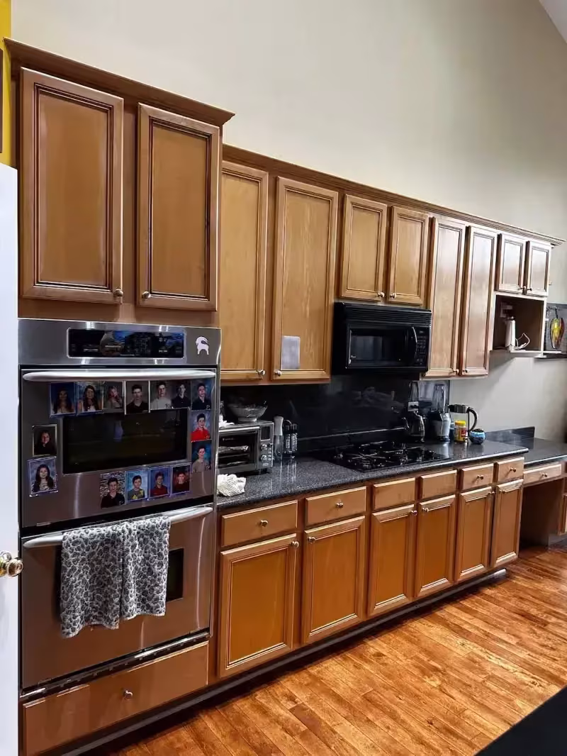 Traditional honey oak raised panel kitchen in Northbrook before door replacement