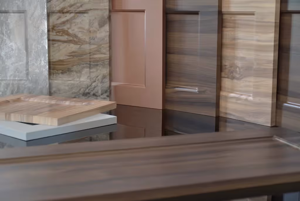 Woodgrain and stone laminate panels fanned out as a colour choice