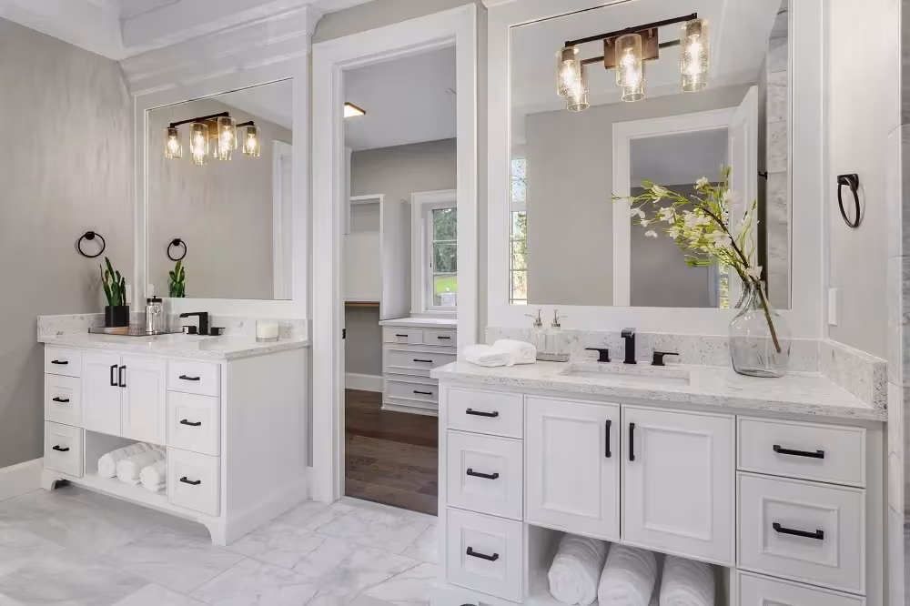 White bathroom vanity with a framed mirror and drawer storage