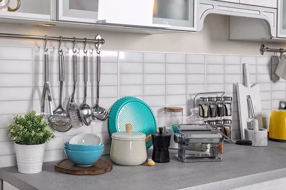 Coordinated teal kitchen accessories arranged on a counter