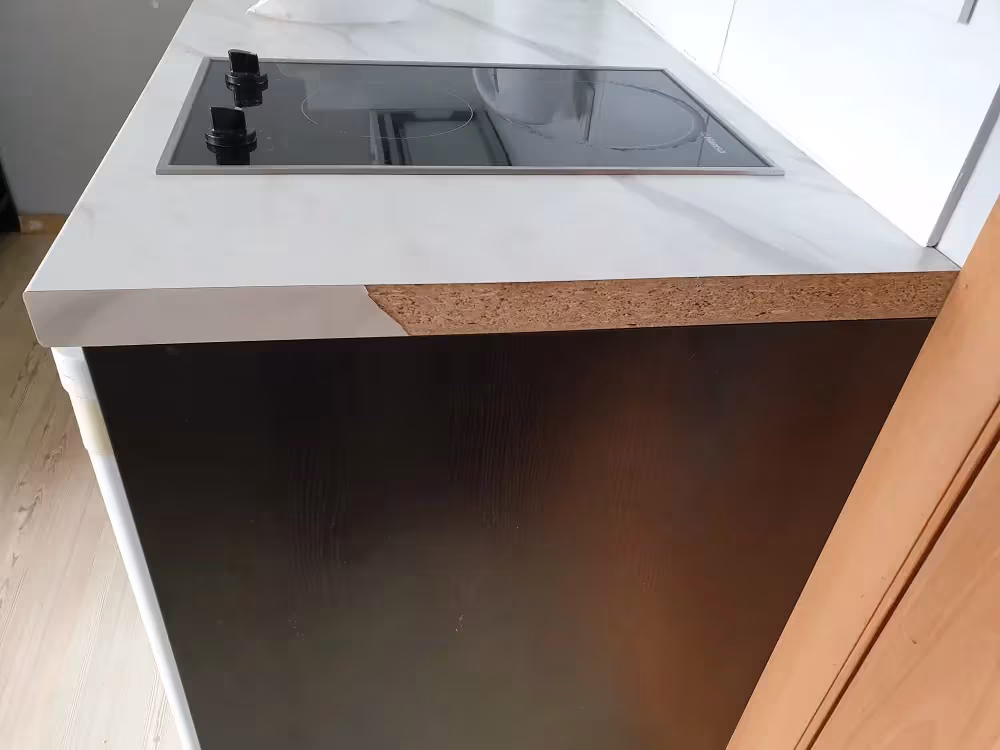 Laminate lifting away from the substrate at a countertop edge