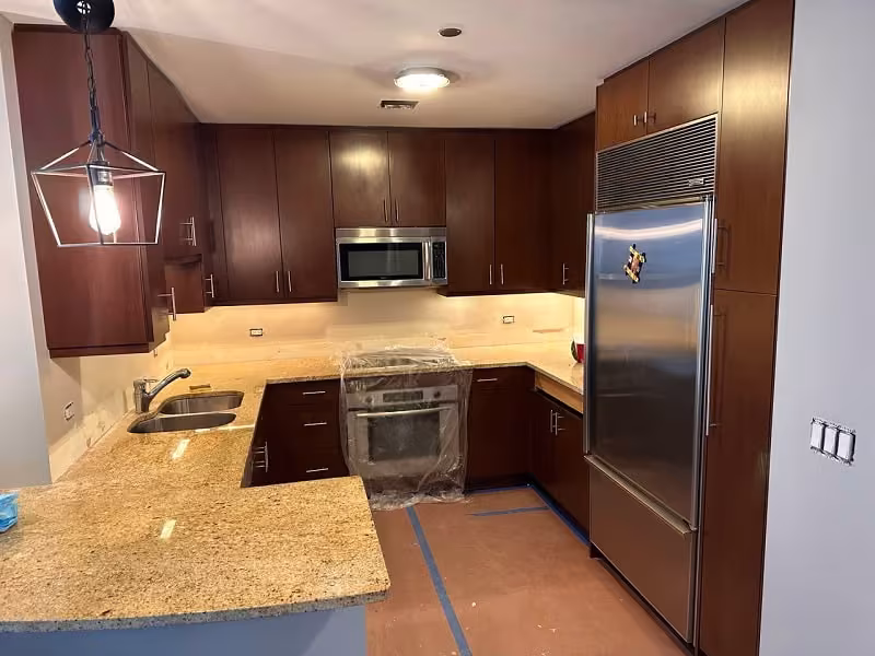 Dark cherry cabinets and granite counters before refacing