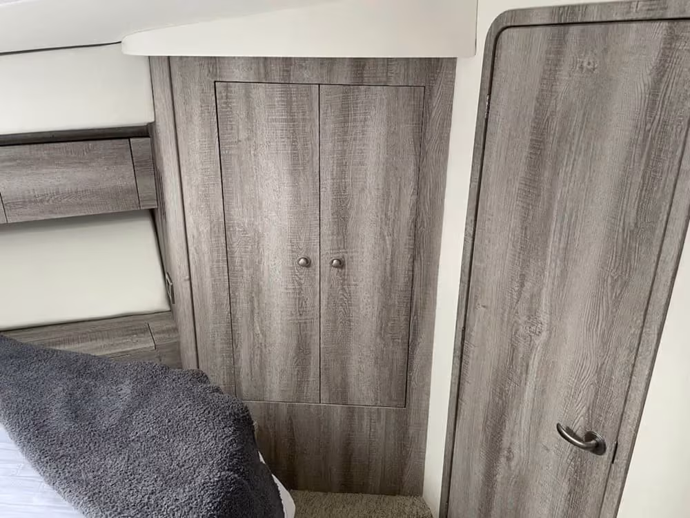 Gray woodgrain cabinets fitted in a utility room for a business client