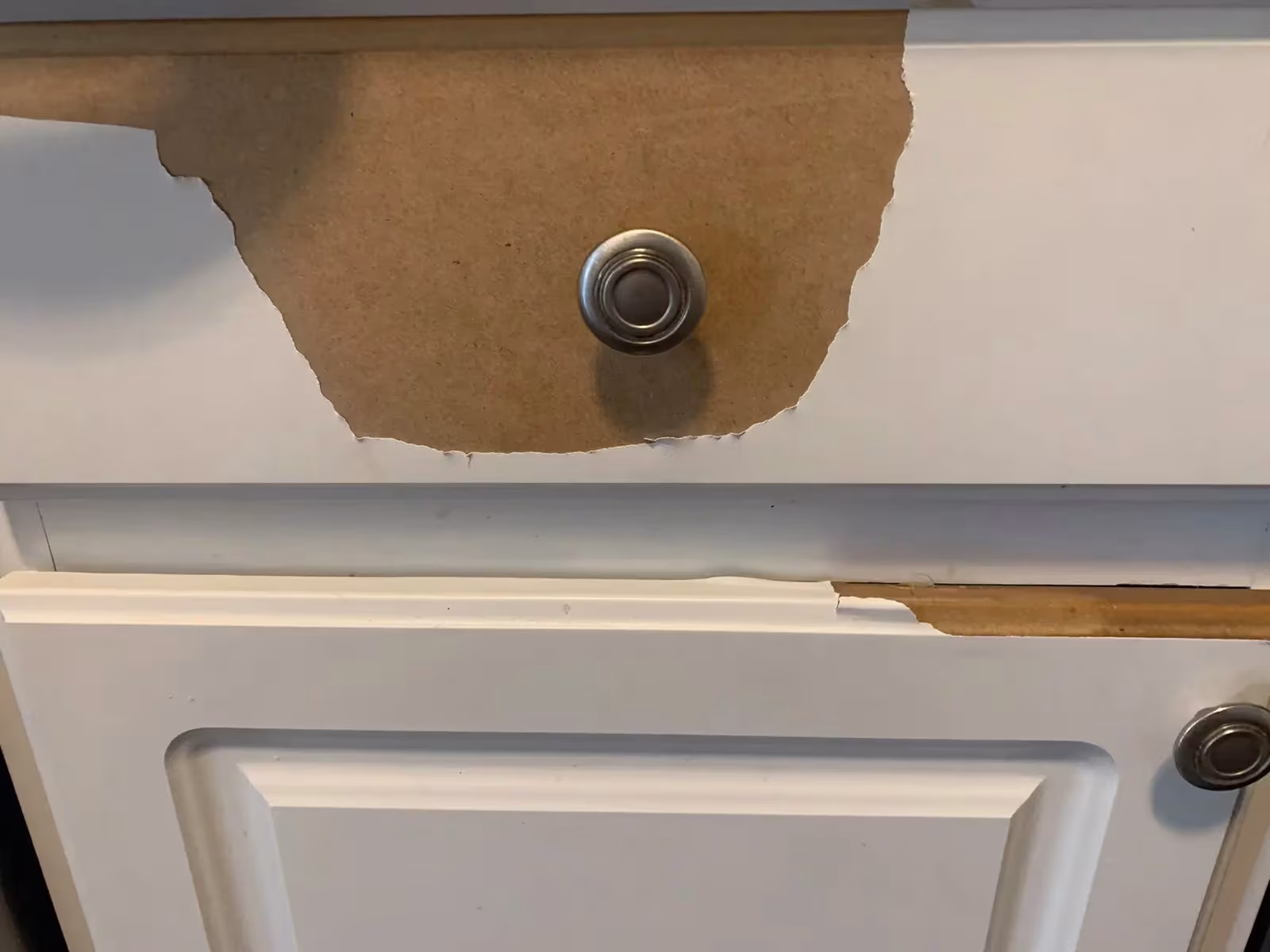Delaminated thermofoil lifting from a cabinet door face
