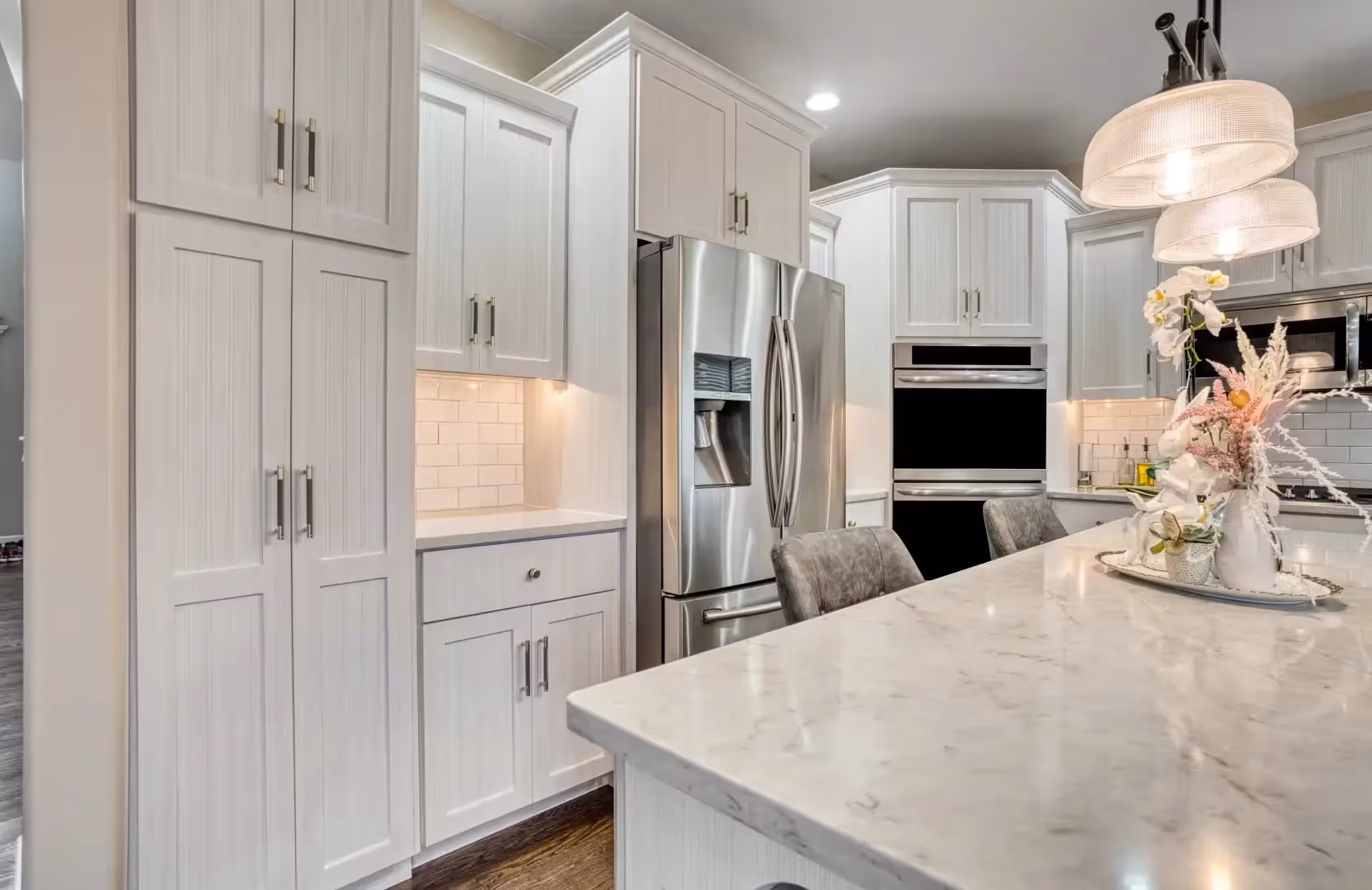 Cream Shaker kitchen with a marble island on day two of refacing