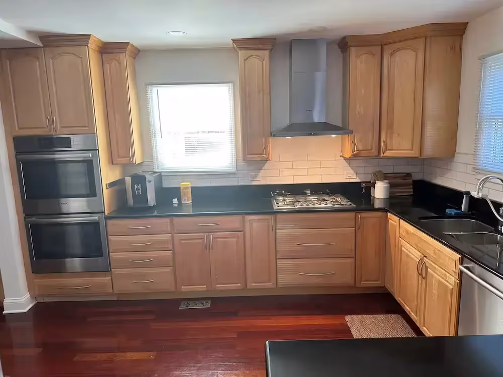 Honey oak cabinets over cherry flooring in Arlington Heights before a pre-sale refacing