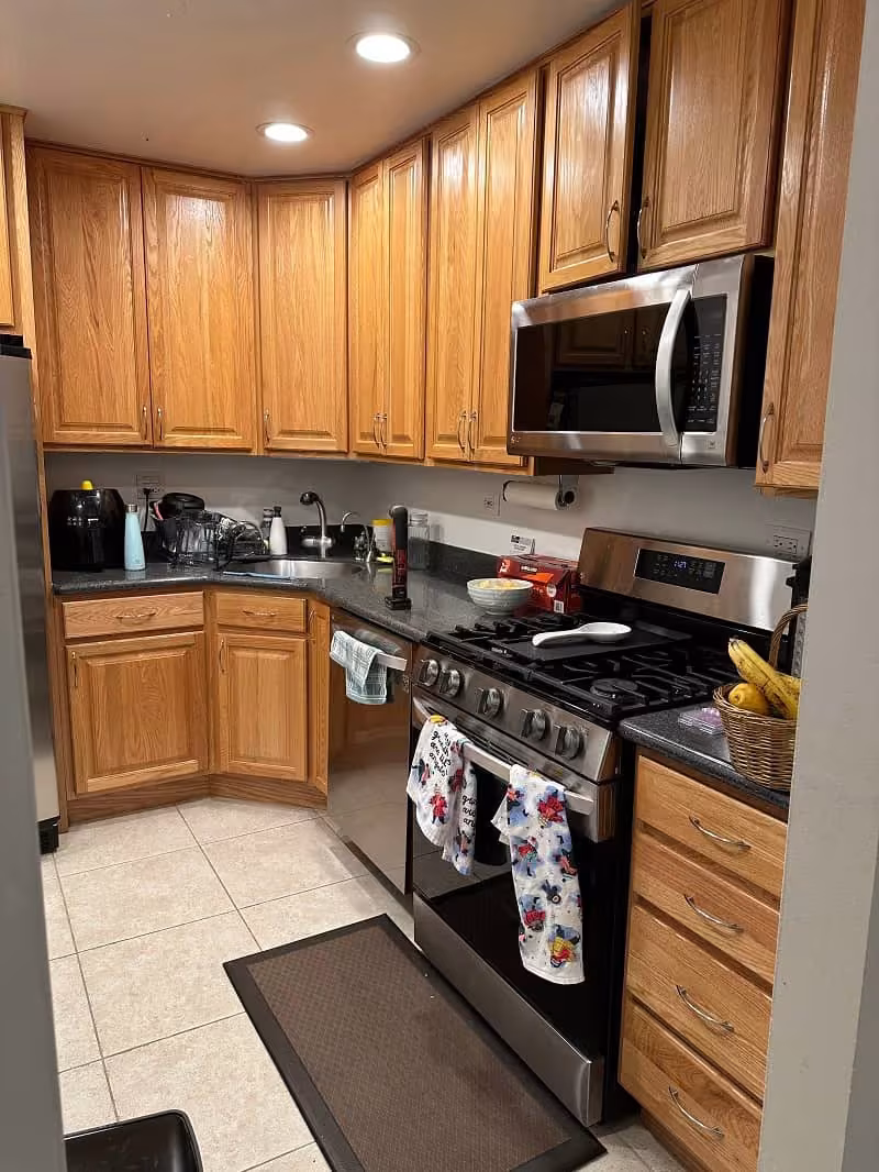 Oak cabinets over tile flooring in a second Arlington Heights kitchen before refacing