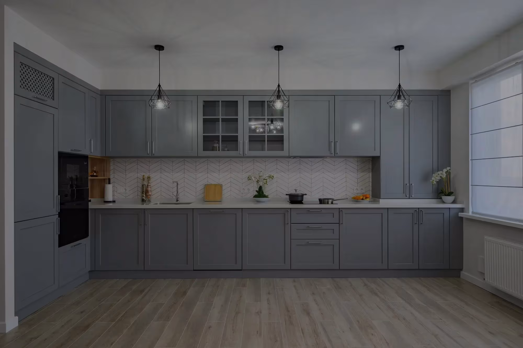 Slate blue cabinetry with glass-front uppers in a Schaumburg kitchen