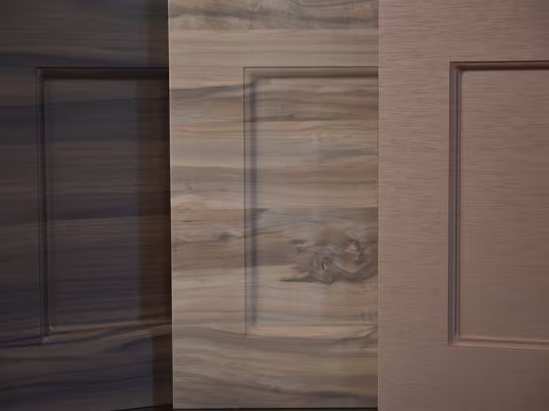Rack of cabinet door samples showing the available wood finishes