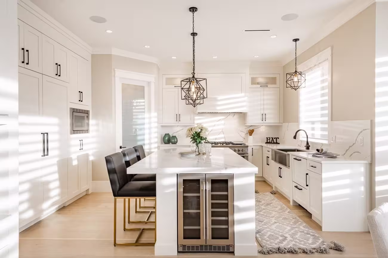 White cabinets, a black island and a built-in wine fridge in Elk Grove Village