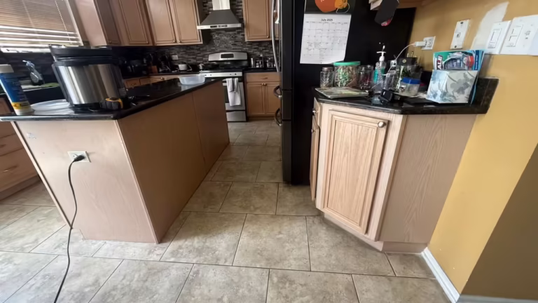 Maple peninsula and island in the open-plan kitchen before the colour change