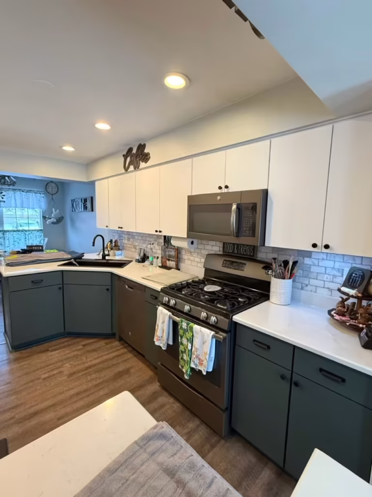 White upper cabinets above teal lowers before the West Chicago kitchen was unified