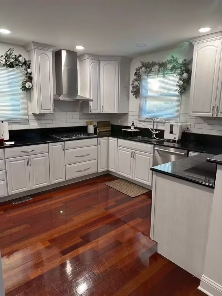White refaced cabinets and a stainless hood readying the Arlington Heights home for sale