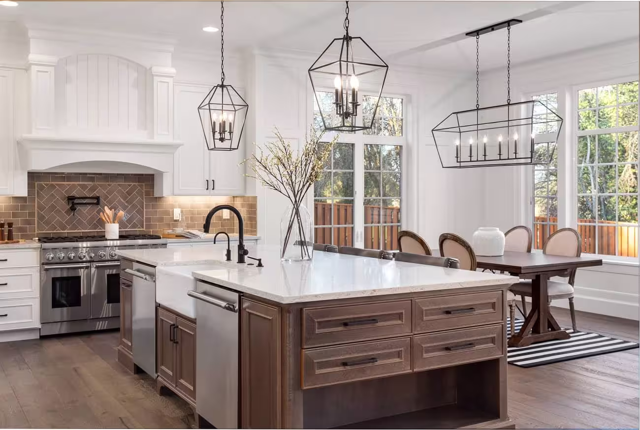 White cabinets and a wood island with a brick backsplash in North Aurora