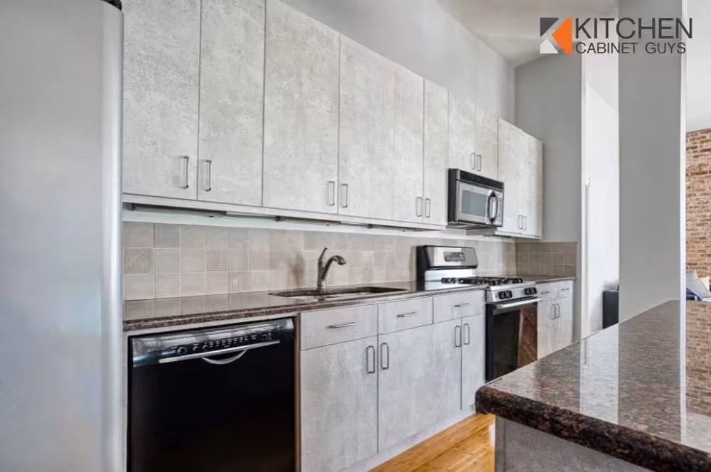 Concrete-look laminate kitchen with granite countertops